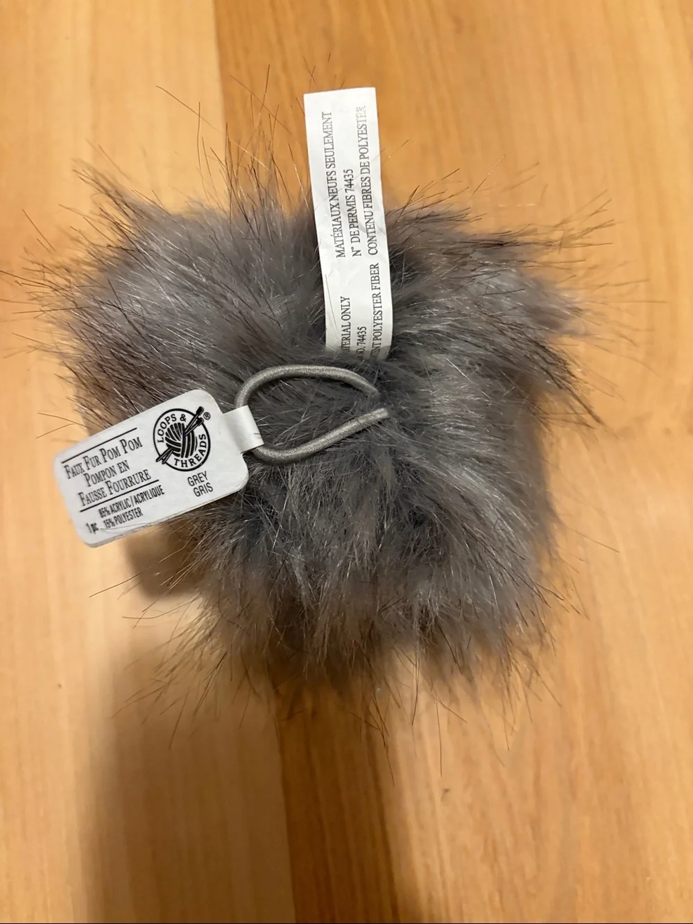 Gray Pom Pom with elastic holder